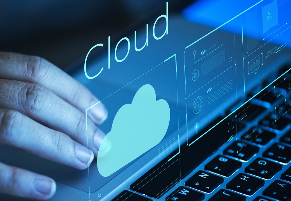 Woman scrolling on a laptop | Cloud security