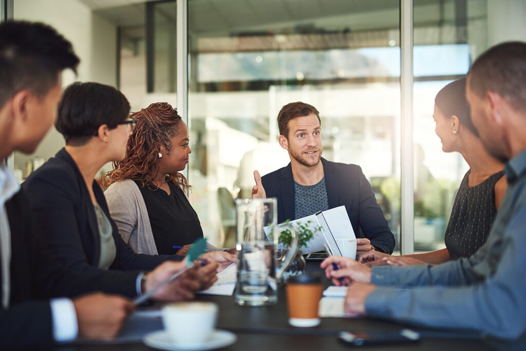 Team, meeting and man in office with leadership, ideas , RIA Business